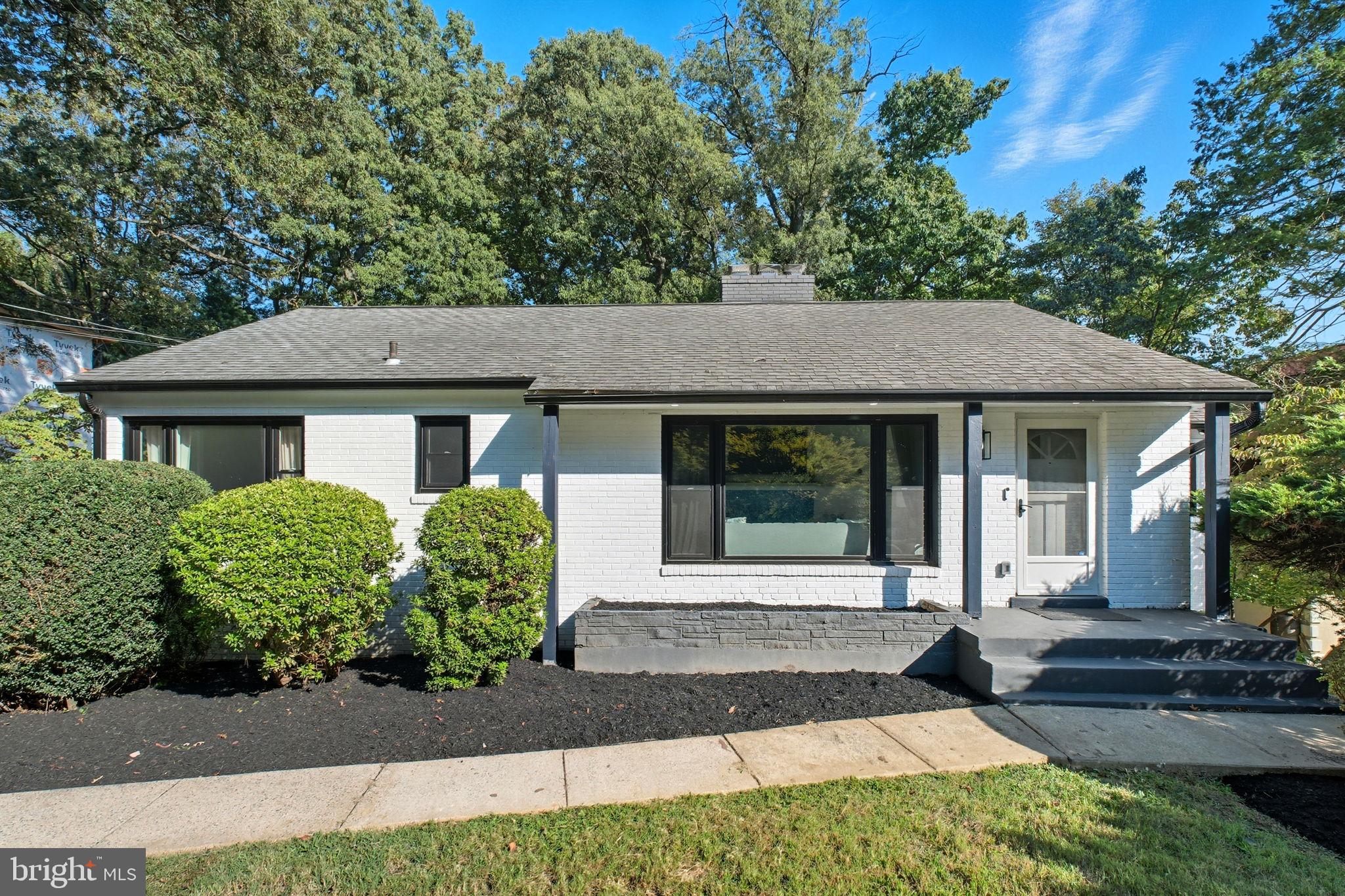 2539 Gallows Road Dunn Loring, VA 22027 - Photo 1 of 43 a front view of a house with garden