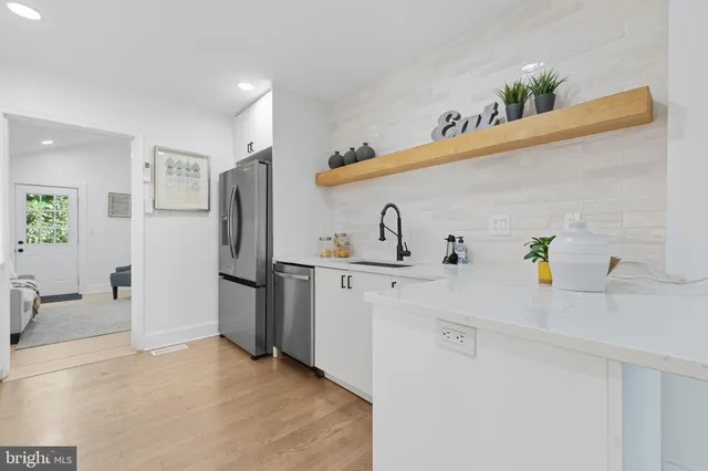 a kitchen with cabinets and appliances