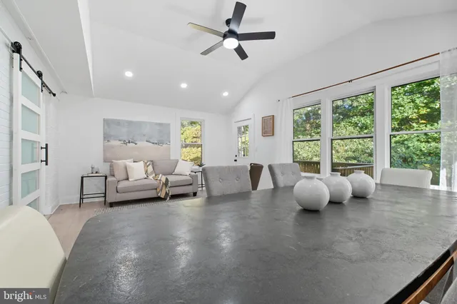 a living room with furniture and a closet