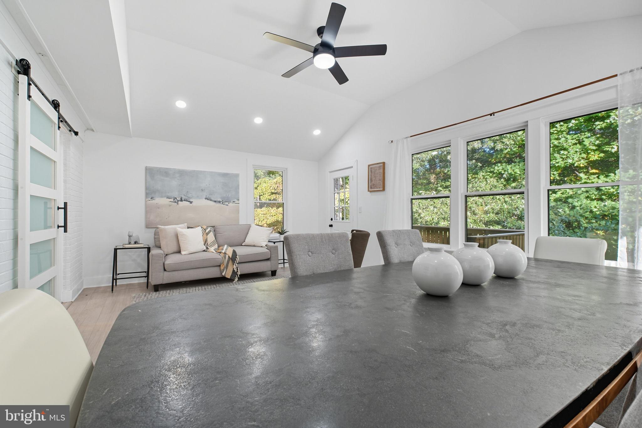 2539 Gallows Road Dunn Loring, VA 22027 - Photo 20 of 43 a living room with furniture and a large window with outer view
