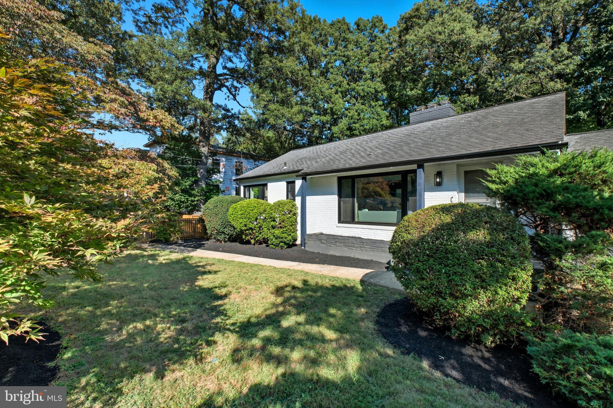 2539 Gallows Road Dunn Loring, VA 22027 - Photo 2 of 43 a front view of a house with a garden
