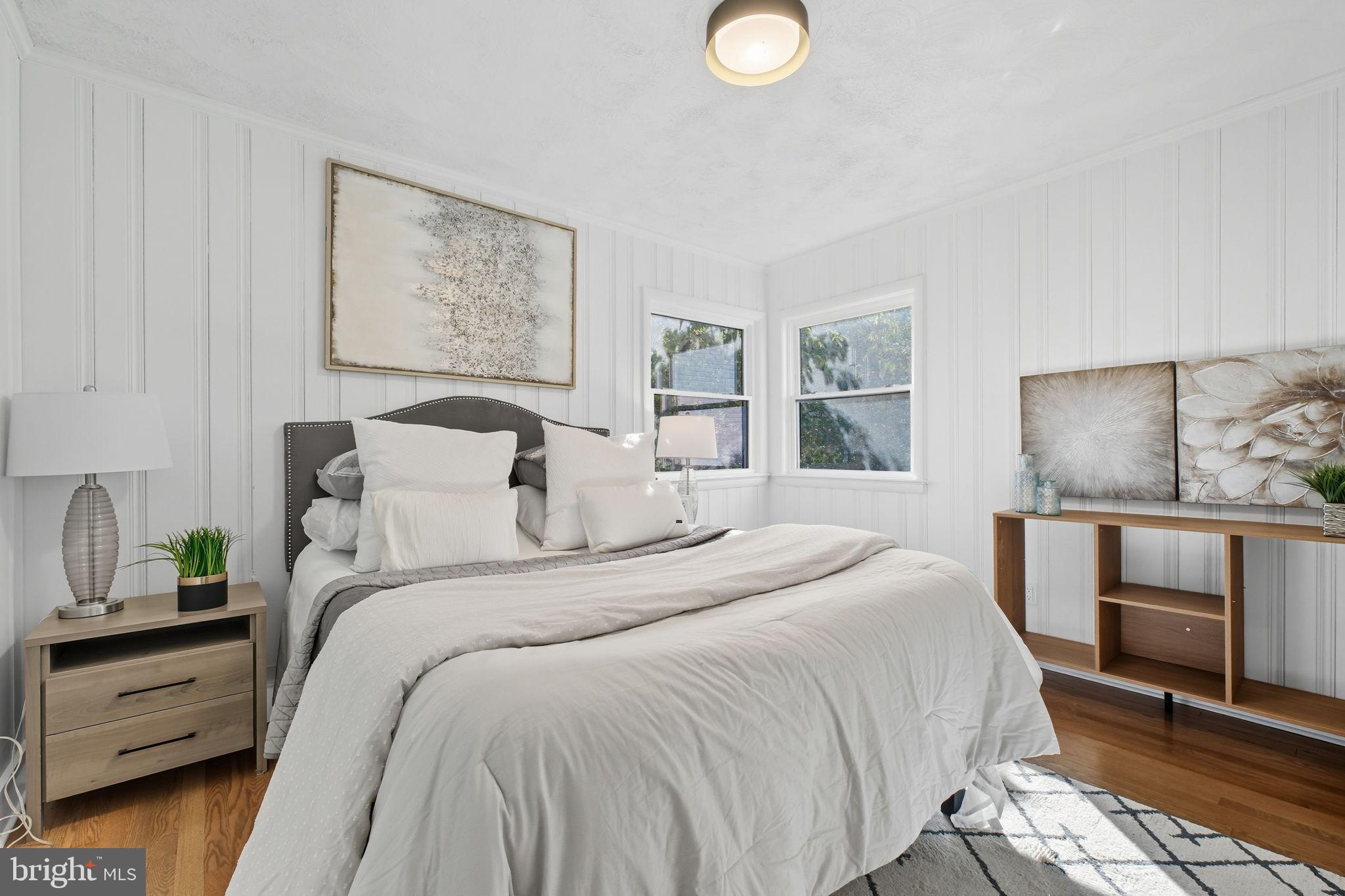 2539 Gallows Road Dunn Loring, VA 22027 - Photo 29 of 43 a bedroom with a bed and a painting on the wall