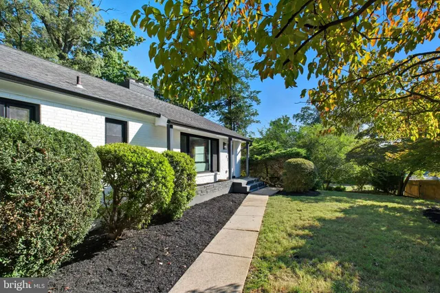 a view of a house with a back yard