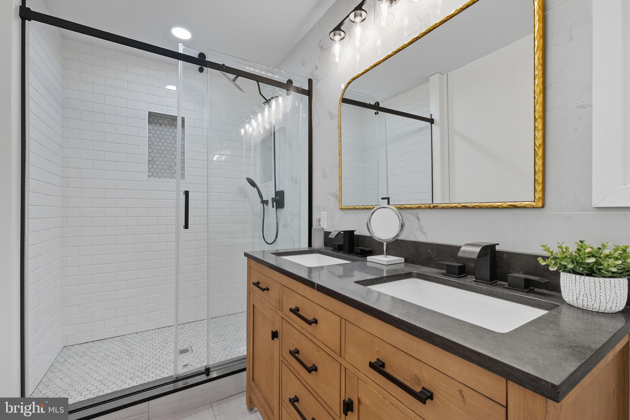 2539 Gallows Road Dunn Loring, VA 22027 - Photo 31 of 43 a bathroom with a sink and a mirror