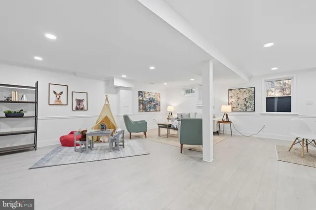 a view of a livingroom with furniture and stairs