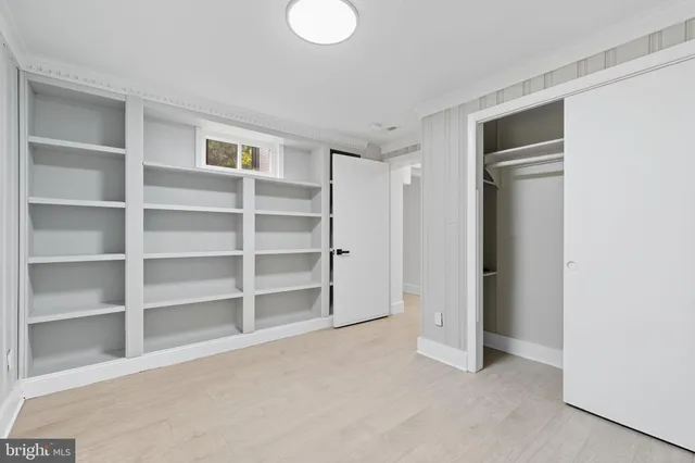 a living room with furniture a dining table and kitchen view