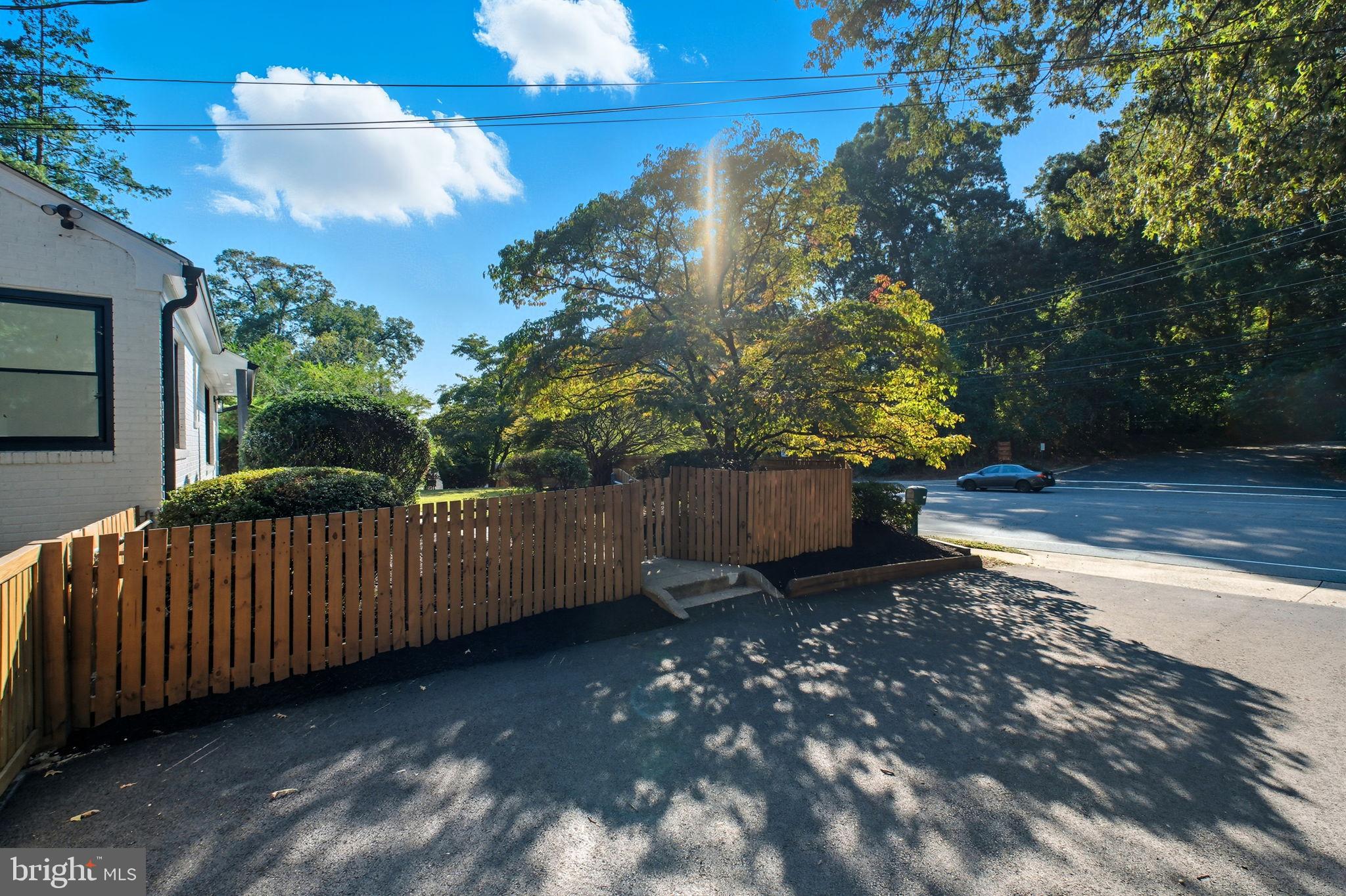 2539 Gallows Road Dunn Loring, VA 22027 - Photo 5 of 43 a view of a yard with wooden fence