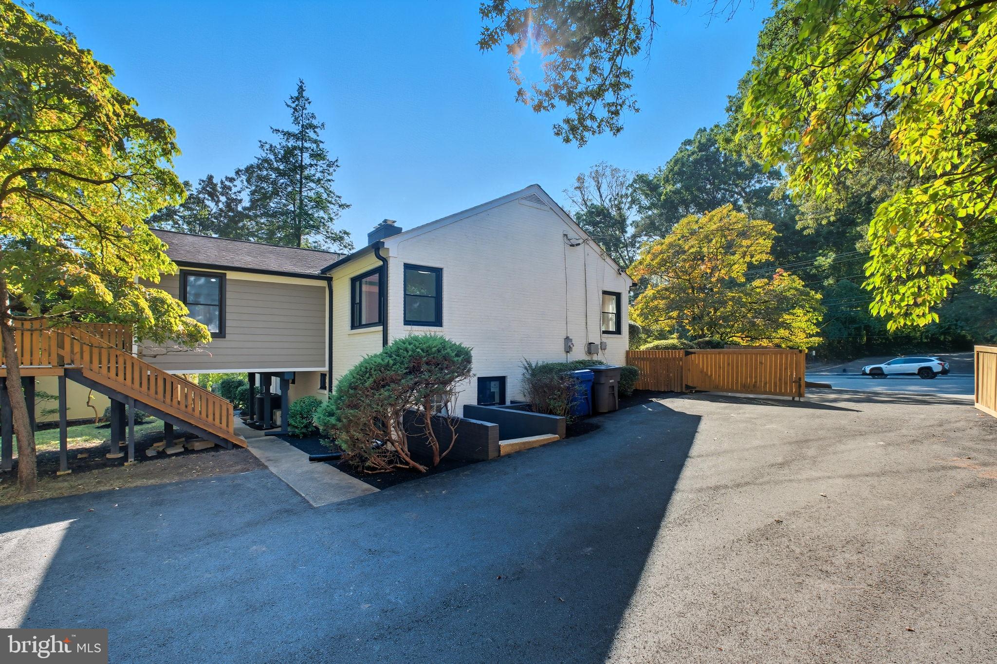 2539 Gallows Road Dunn Loring, VA 22027 - Photo 6 of 43 a view of a house with patio and a garden