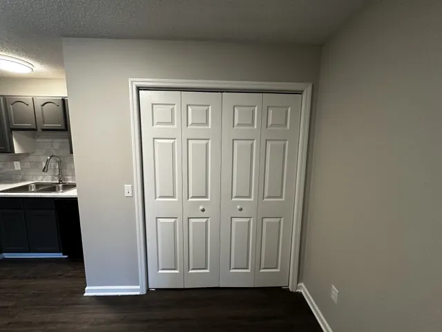 a view of front door with wooden floor