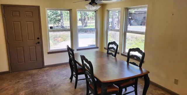 a view of living room and kitchen with wooden floor
