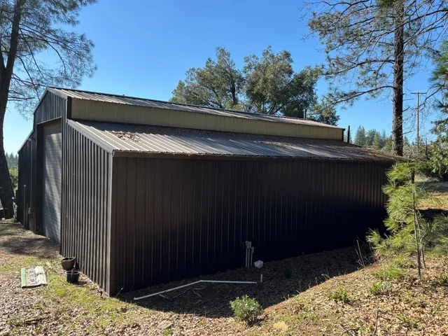 a house with trees in the background
