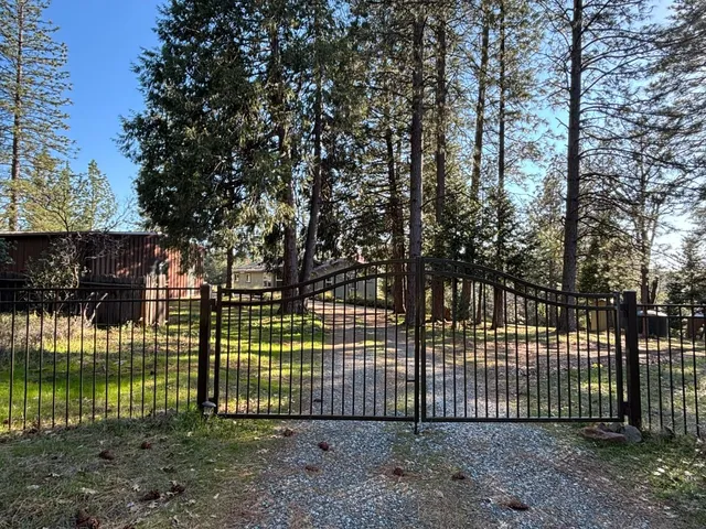 a view of a house with a small yard
