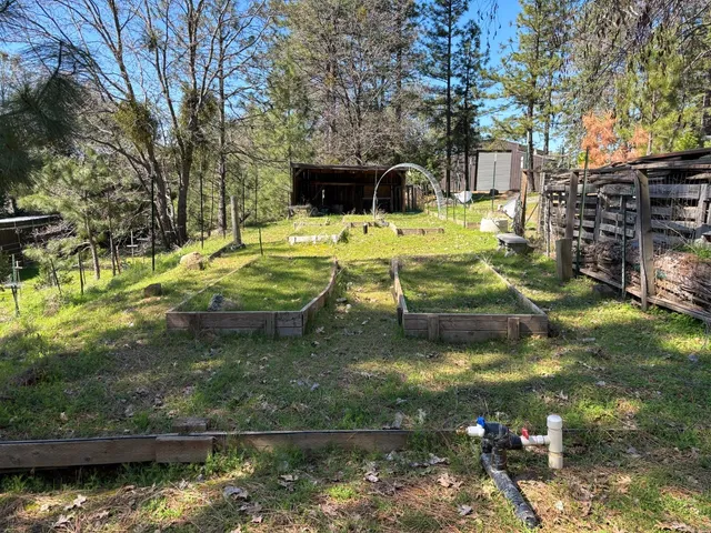 a view of a house with swimming pool and sitting area