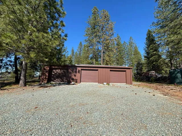 a view of garage and yard
