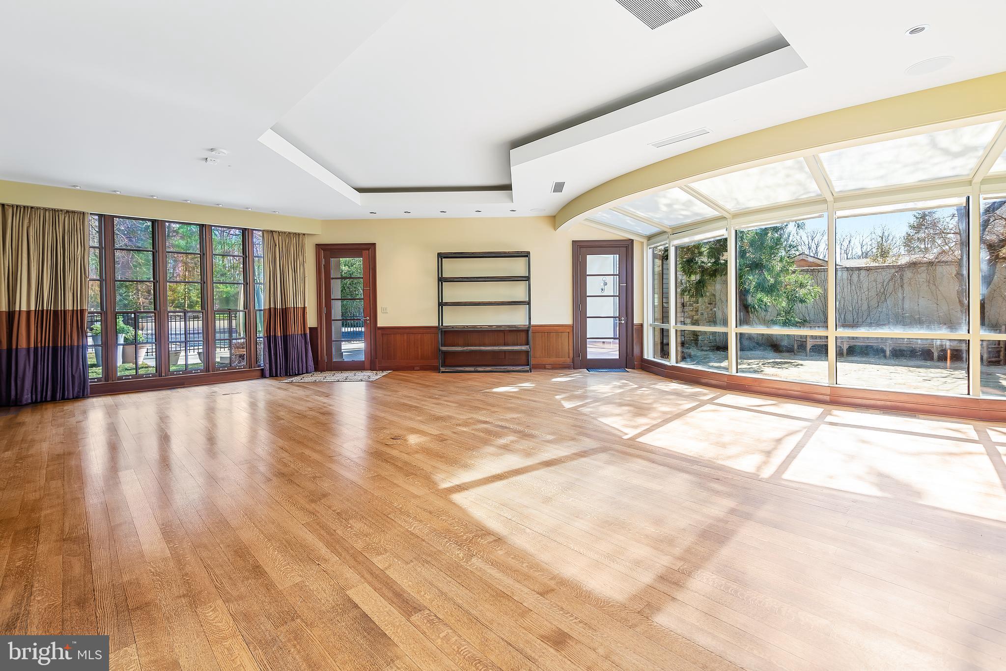 10111 Iron Gate Road Potomac, MD 20854 - Photo 12 of 94 a view of an empty room with wooden floor and a window