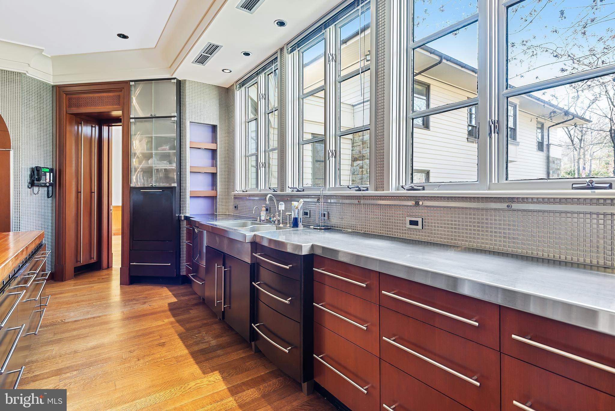 10111 Iron Gate Road Potomac, MD 20854 - Photo 28 of 94 a spacious bathroom with double vanity and a large mirror