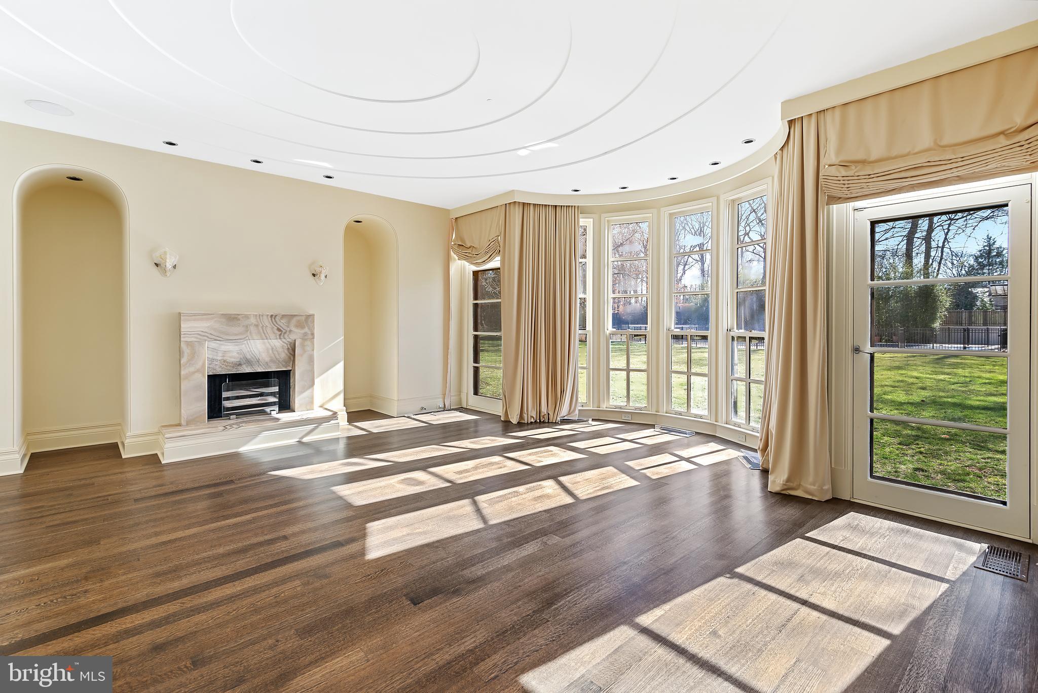 10111 Iron Gate Road Potomac, MD 20854 - Photo 41 of 94 a view of an empty room with wooden floor and a window