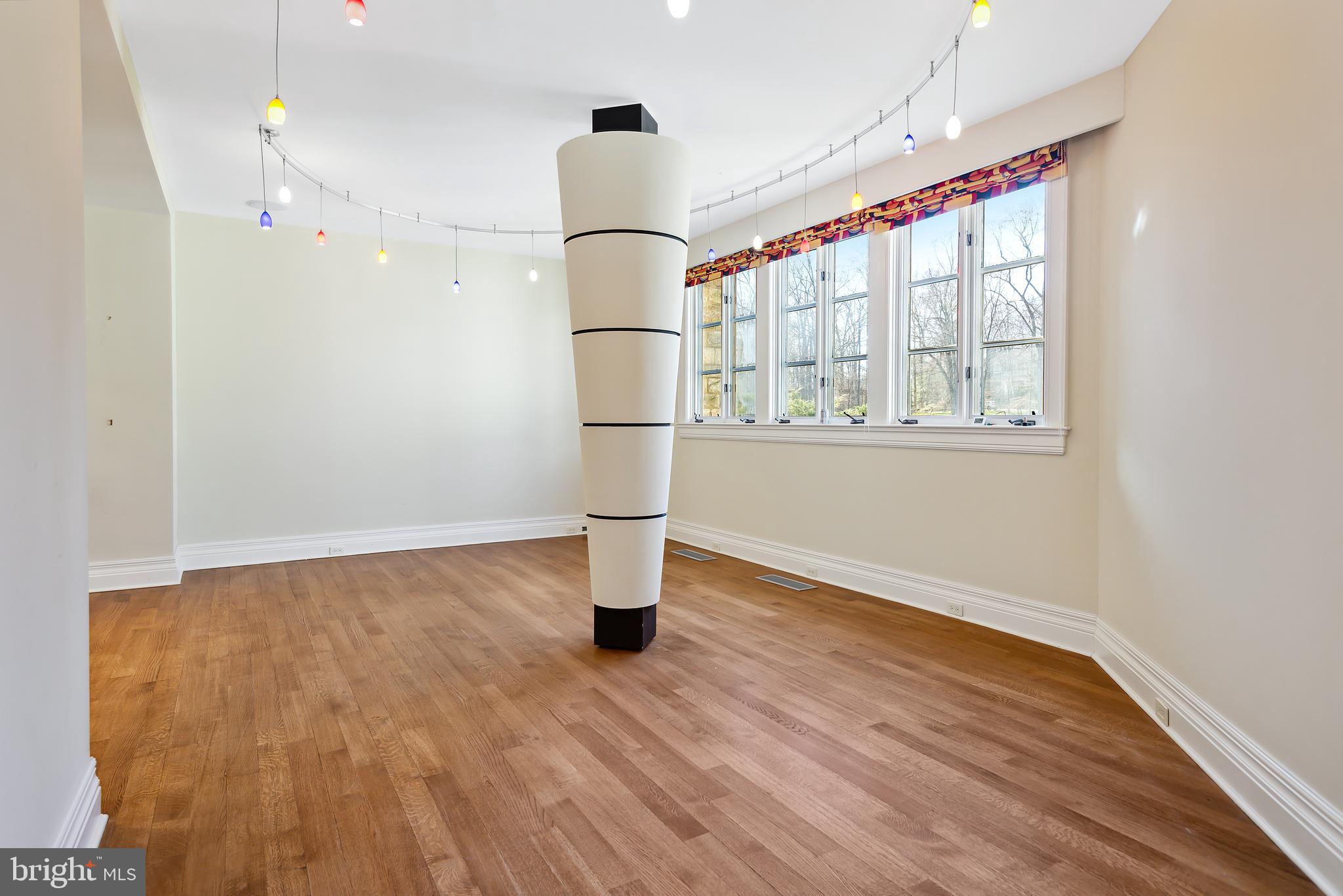 10111 Iron Gate Road Potomac, MD 20854 - Photo 54 of 94 a view of empty room with wooden floor and fan