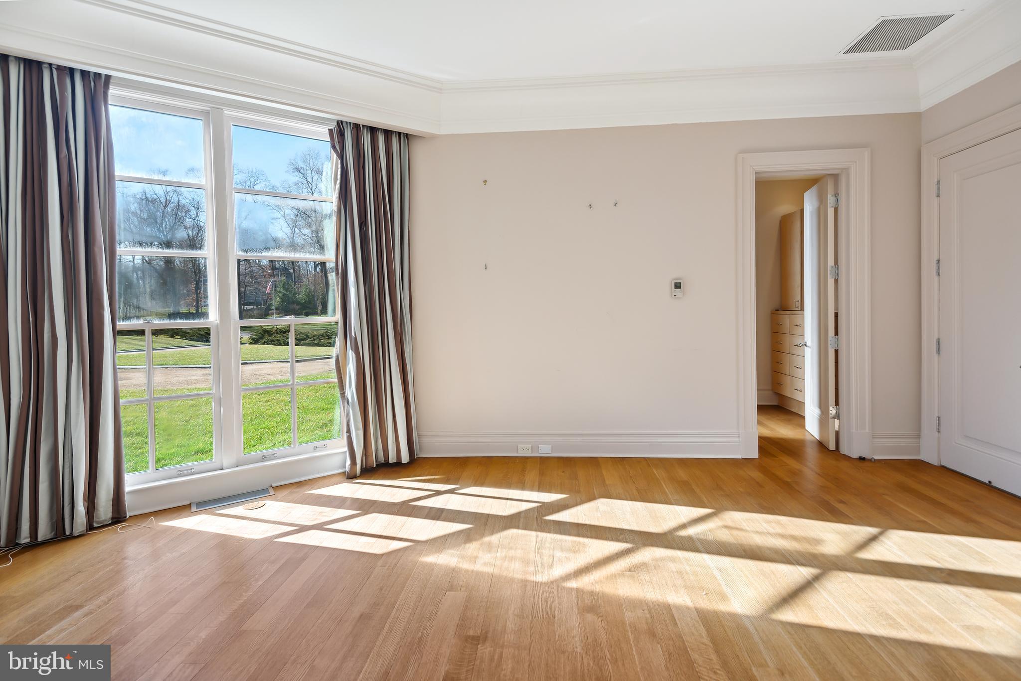 10111 Iron Gate Road Potomac, MD 20854 - Photo 56 of 94 a view of a livingroom with wooden floor and a window