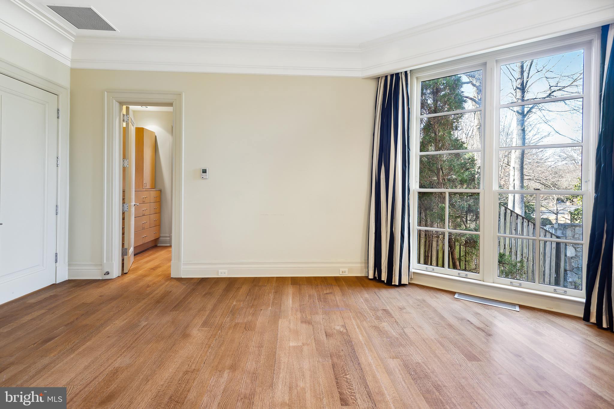 10111 Iron Gate Road Potomac, MD 20854 - Photo 58 of 94 an empty room with wooden floor and windows