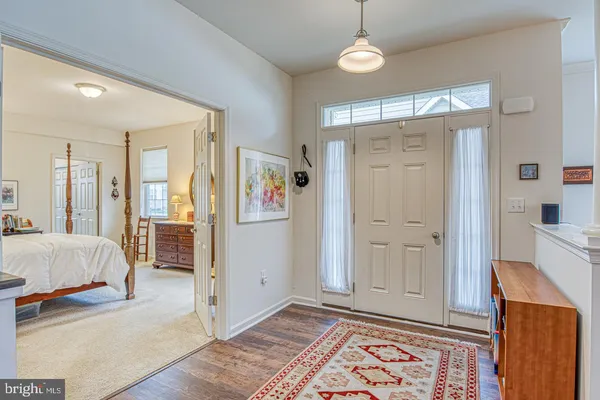 a spacious bedroom with a bed and a walk in closet