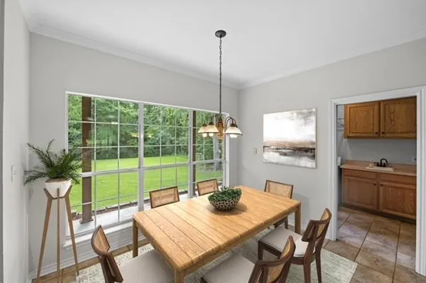a view of a dining room and furniture window and outside view