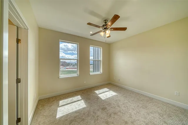 a bathroom with a granite countertop sink mirror and a shower