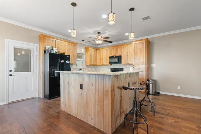 a view of a kitchen with furniture and a chandelier