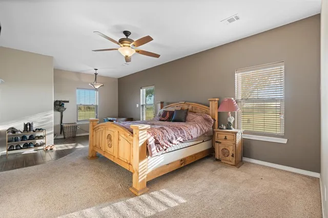 a bedroom with a bed and window