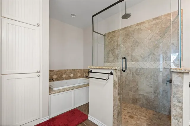 a bathroom with a shower and a sink