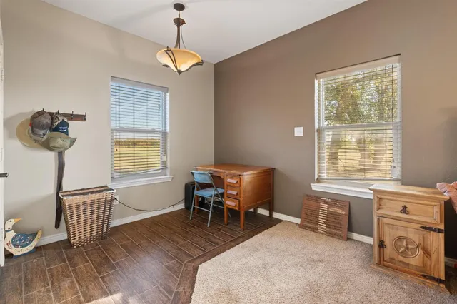 a bedroom with furniture and a window