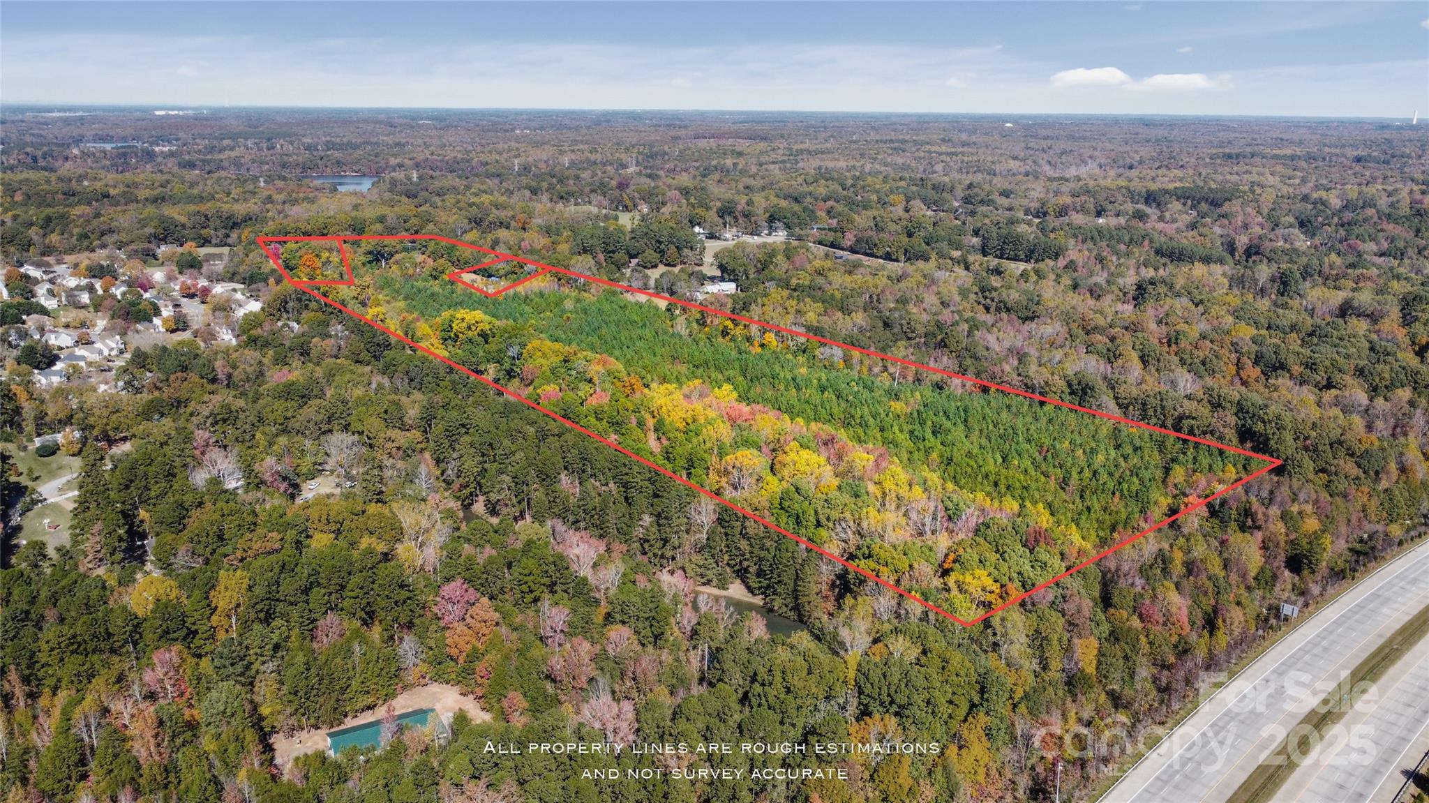 4940 Mt Holly-Huntersville Road Charlotte, NC 28216 - Photo 7 of 18 an aerial view of residential houses with outdoor space and trees