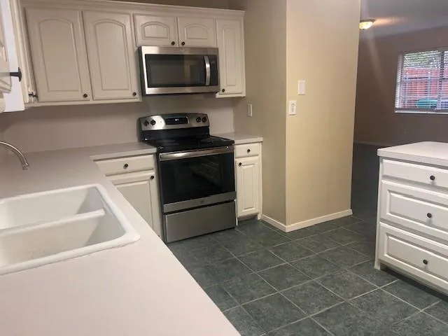 a view of a hallway with a wooden door