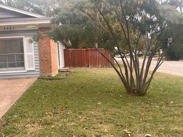 a view of backyard with green space