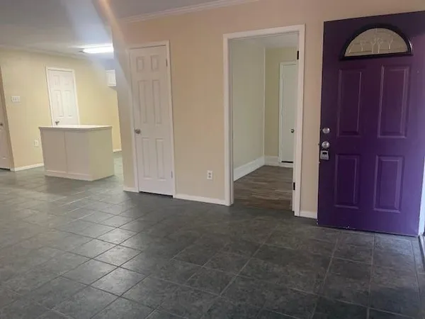 a view of an empty room and window