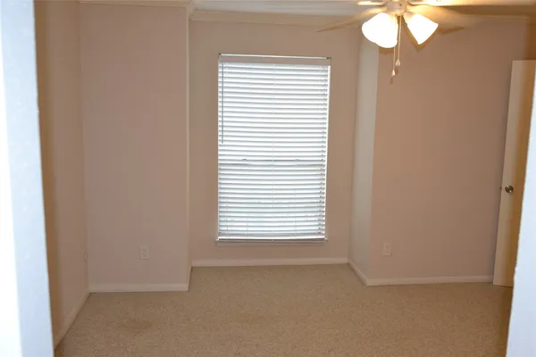 an empty room that has a window in it