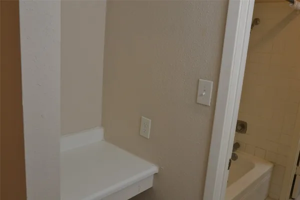 a bathroom with a sink and mirror