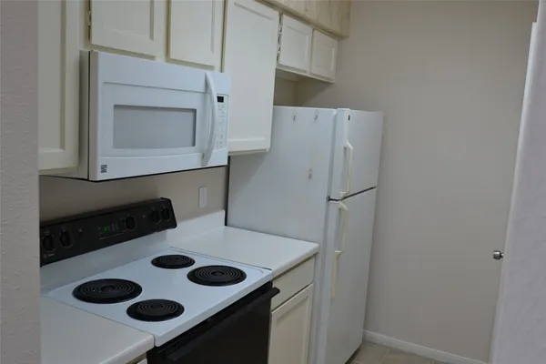 a utility room with a sink washer and dryer