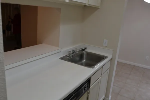 a kitchen with a stove and a refrigerator