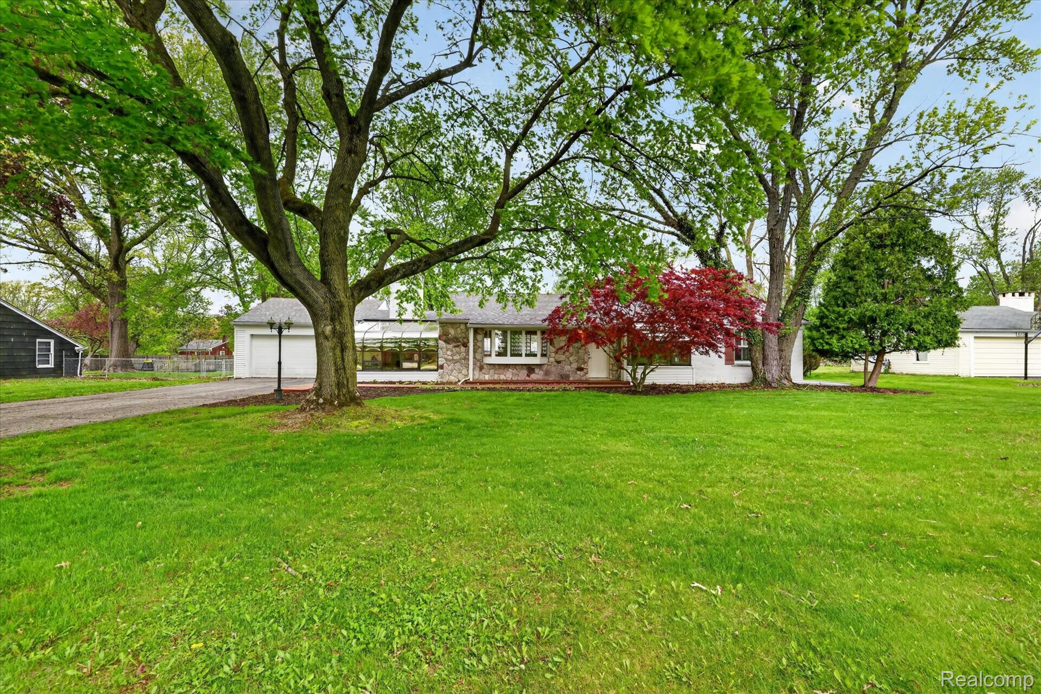 6576 Inkster Road West Bloomfield, MI 48322 - Photo 54 of 62 Single story home featuring a garage, a front yard, and brick siding