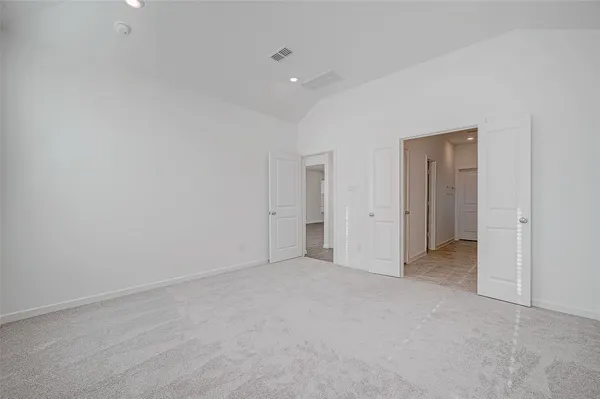 a spacious bathroom with a shower and a sink