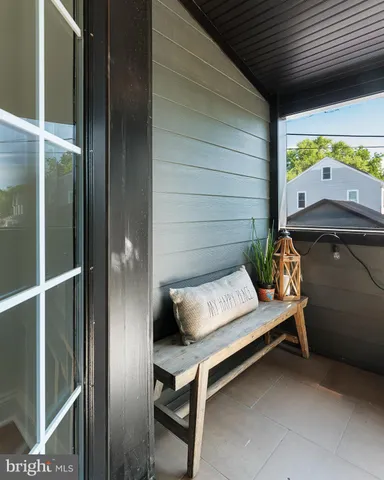 a bench sitting in front of a door