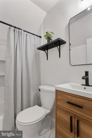 a bathroom with a toilet and a sink