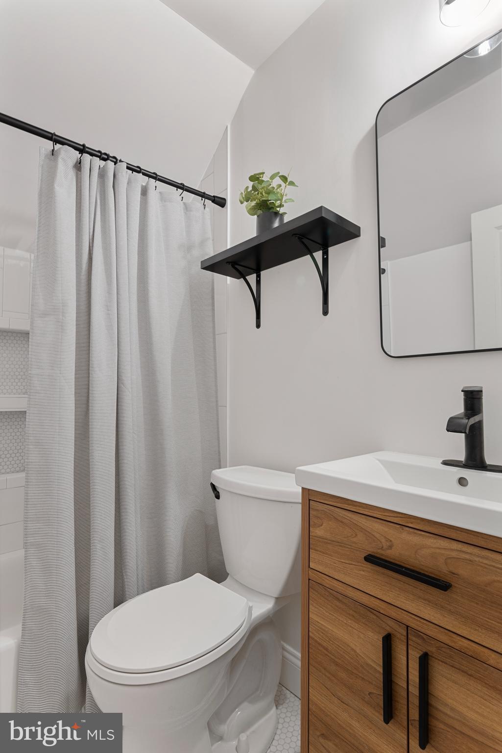 1000 West Street, Unit 200 Annapolis, MD 21401 - Photo 15 of 23 a bathroom with a toilet and a sink