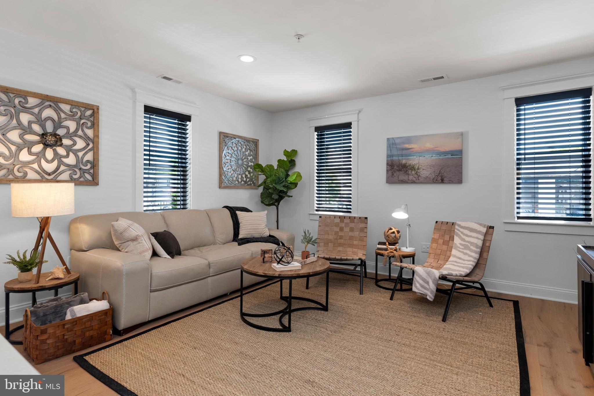 1000 West Street, Unit 200 Annapolis, MD 21401 - Photo 2 of 23 a living room with furniture and a large window