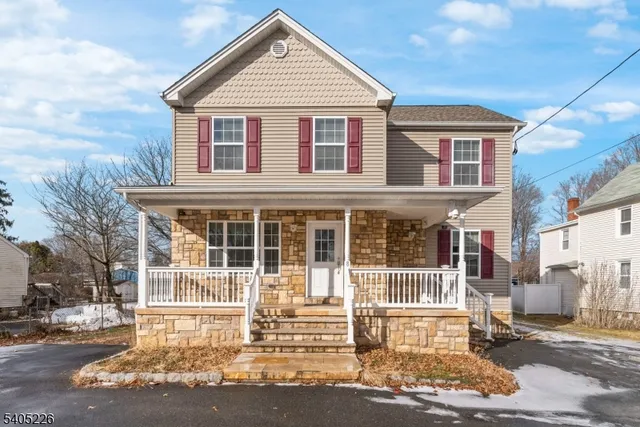 a view of a white house with large windows