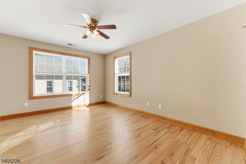 8 Kenvil Avenue Succasunna, NJ 07876 - Photo 11 of 21 wooden floor in an empty room with a window