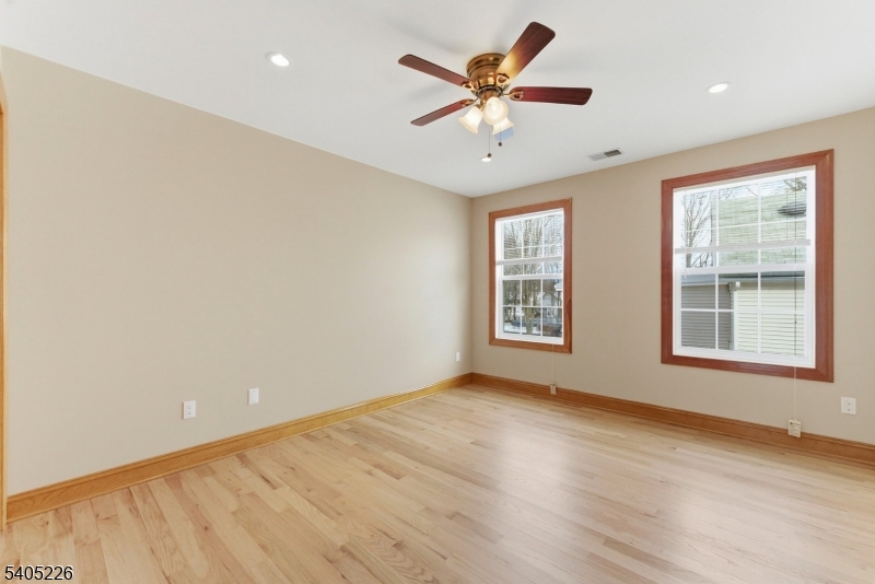 8 Kenvil Avenue Succasunna, NJ 07876 - Photo 12 of 21 wooden floor in an empty room with a window