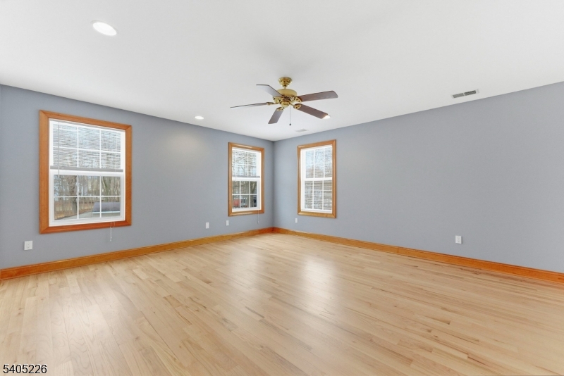 8 Kenvil Avenue Succasunna, NJ 07876 - Photo 13 of 21 an empty room with wooden floor and windows