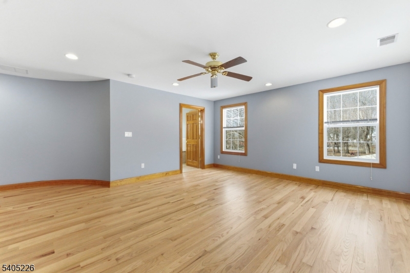 8 Kenvil Avenue Succasunna, NJ 07876 - Photo 14 of 21 an empty room with wooden floor and windows